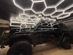 4Runner in the detail bay under honeycomb lighting