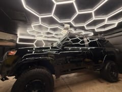 4Runner in the detail bay under honeycomb lighting