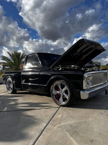Black classic Chevrolet C10 pickup, show-ready