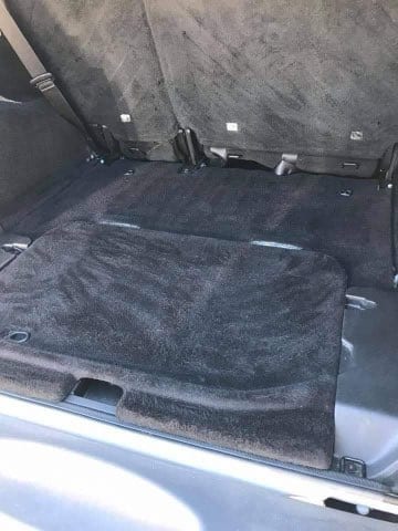 Spotless vacuumed SUV cargo area after detailing