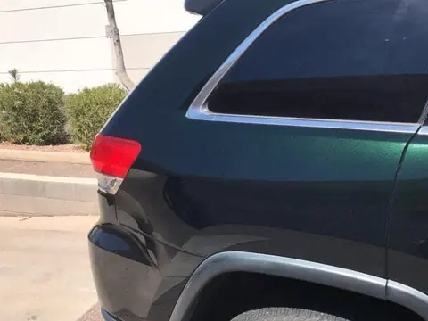 Metallic green Jeep Grand Cherokee paint restored to a deep flake
