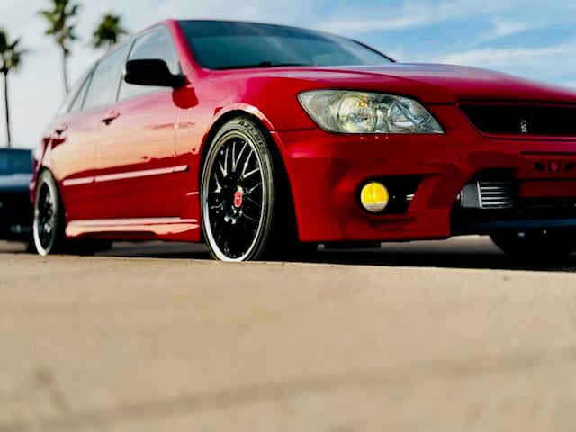 Candy red Lexus IS300 lowered on black wheels