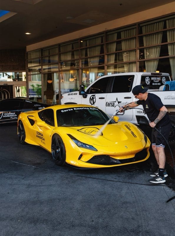 Nico washing a Corsa America Ferrari with the Mirror Finish truck at the host hotel